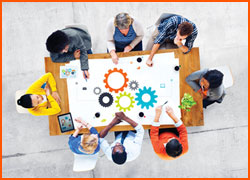 Diverse group of people sitting at a work table